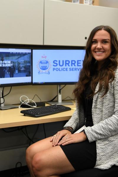 Caitlin Young, HR advisor pictured at desk